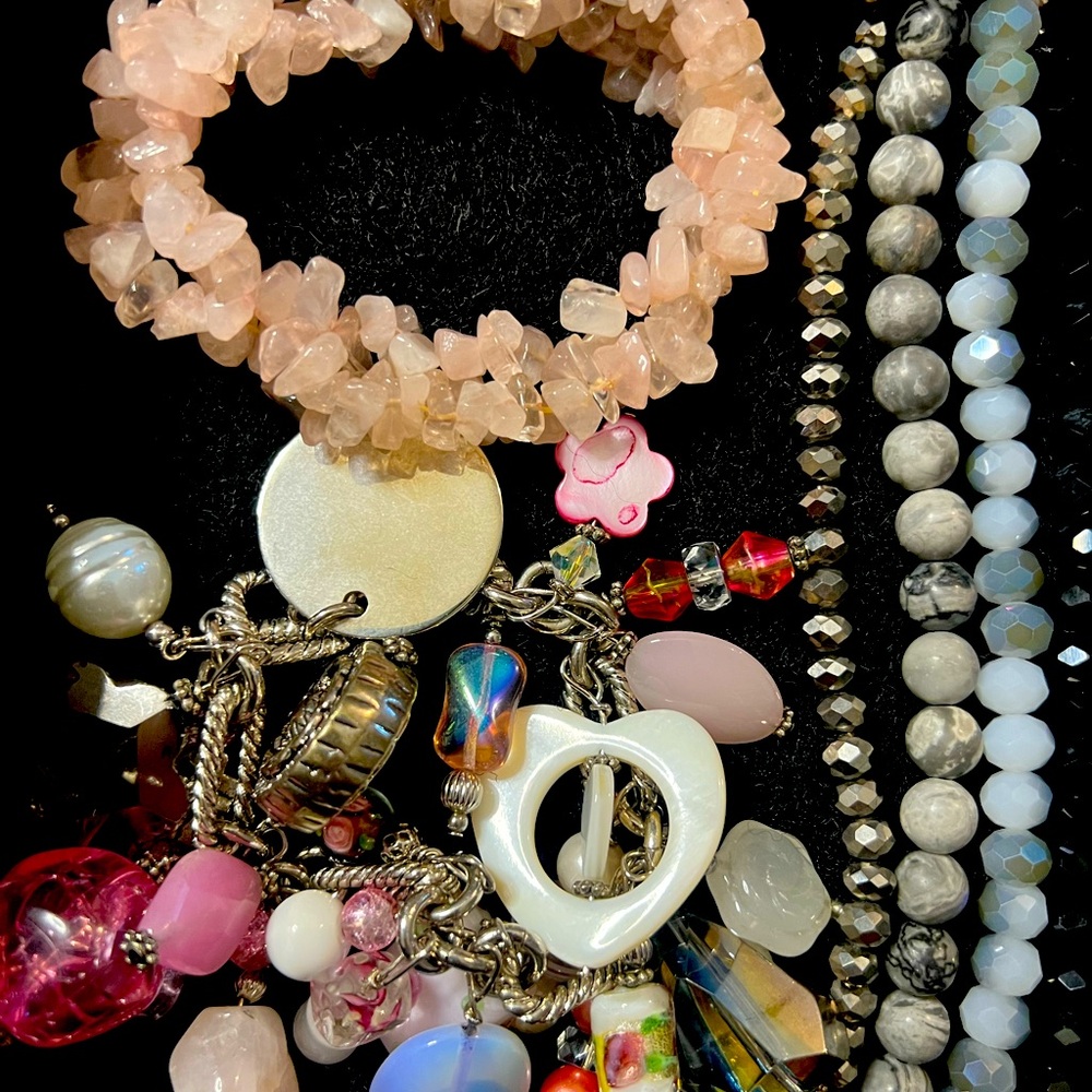 2 bracelets and one Apple Watch band bracelet